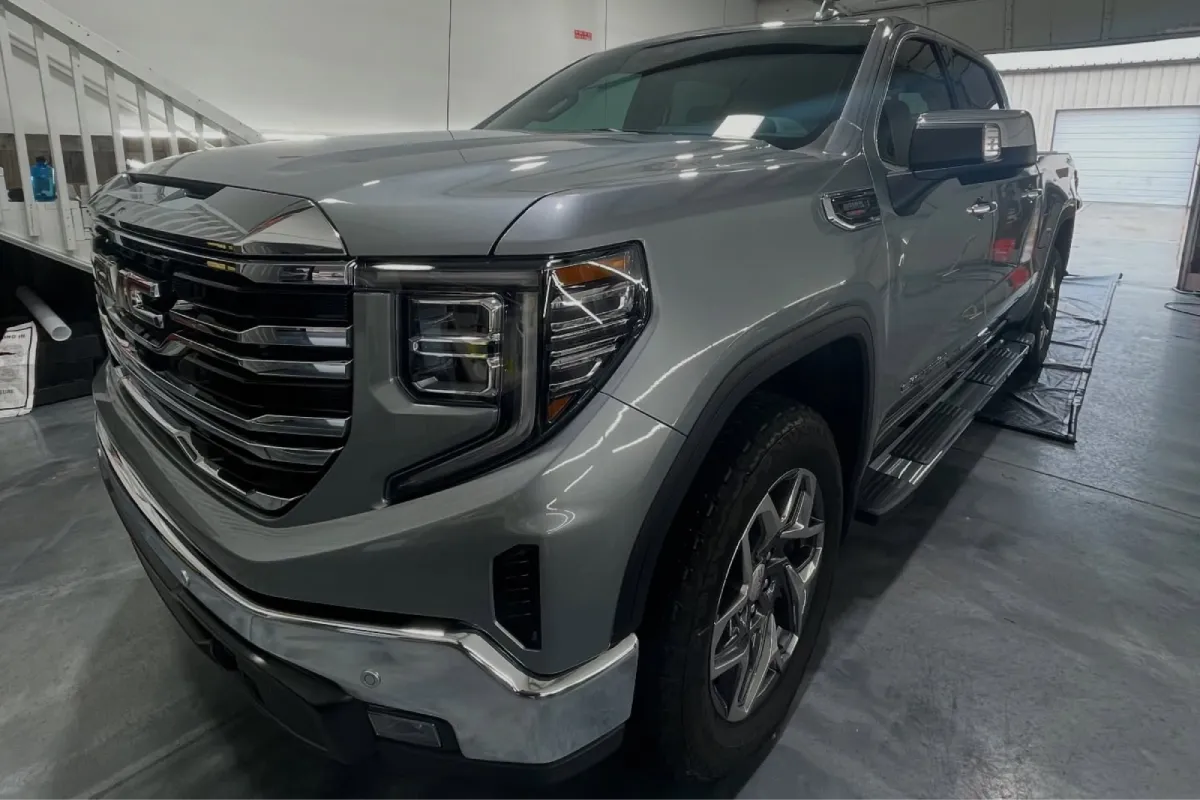 GMC Sierra truck with ceramic coating inside detailing shop.
